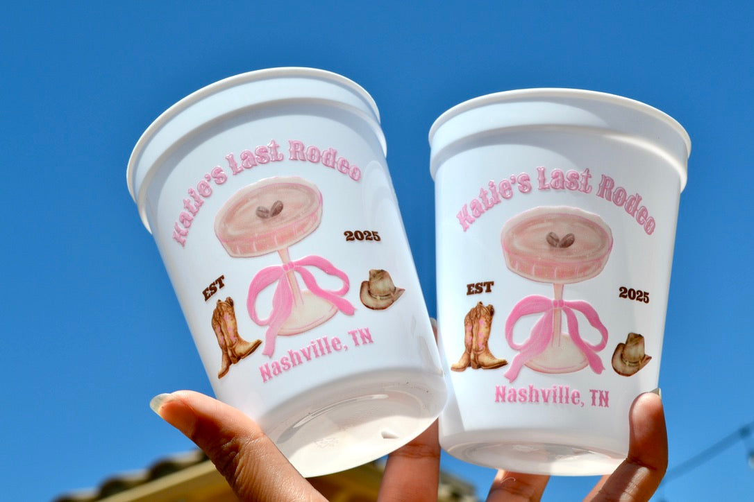 Two plastic cups with a design and text on a clear blue sky background