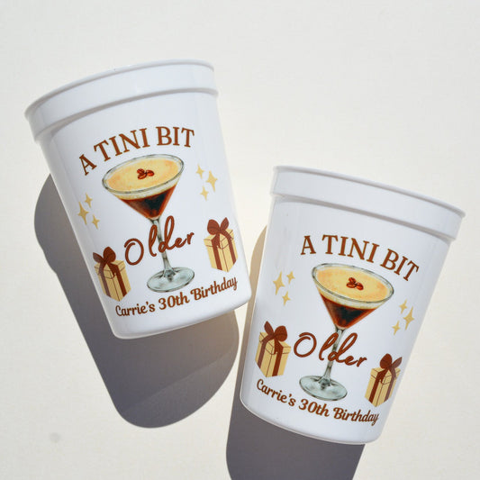 Two personalized cups with a design of a cocktail and text on a white background