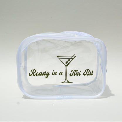 Clear bag with green lettering that reads 'Ready in a Tini Bit' with a martini theme on a white background