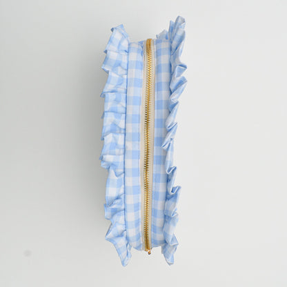 Blue checkered pouch with a gold zipper on a white background