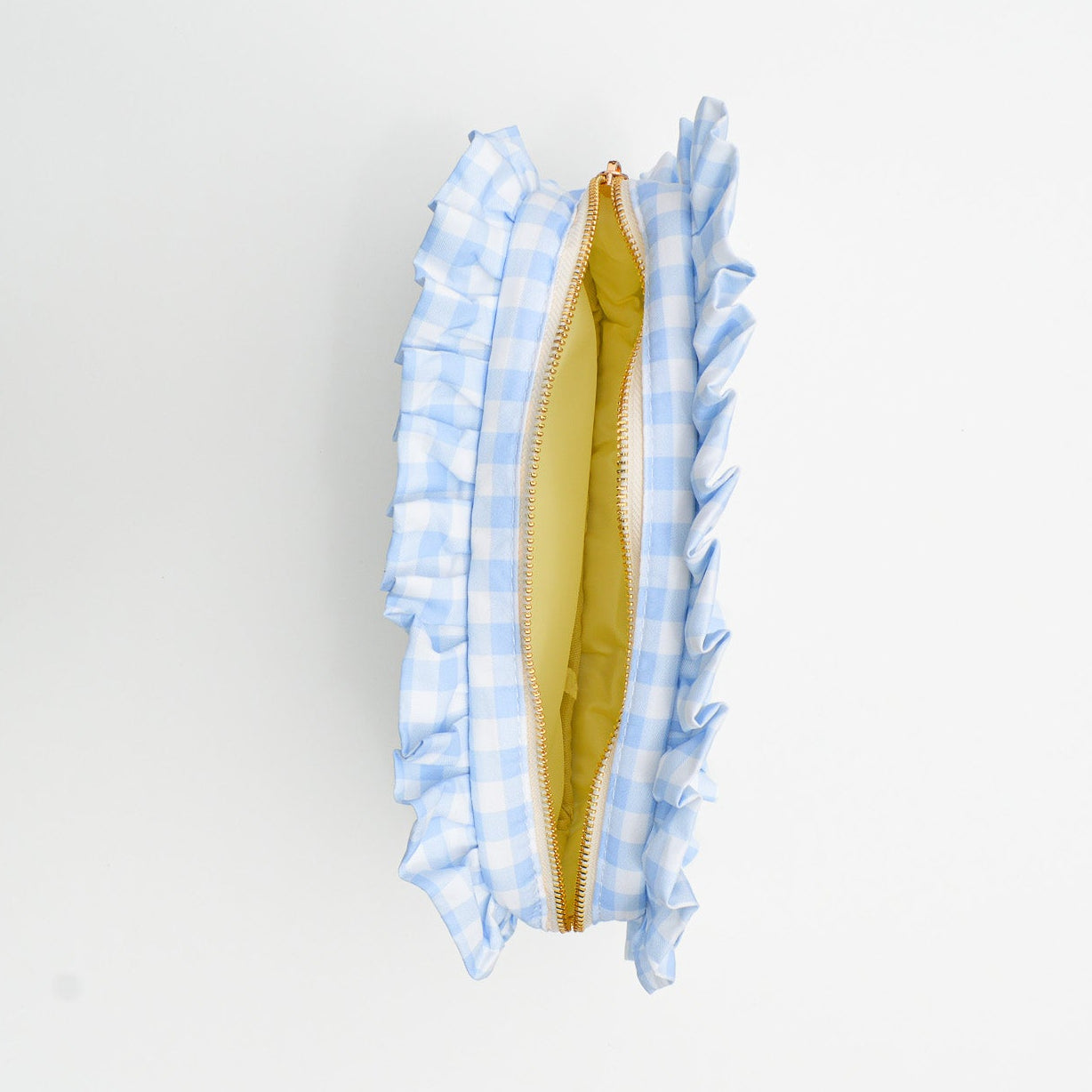 Close-up of a bag with blue checkered trim on a white background