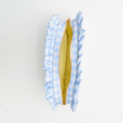 Close-up of a bag with blue checkered trim on a white background