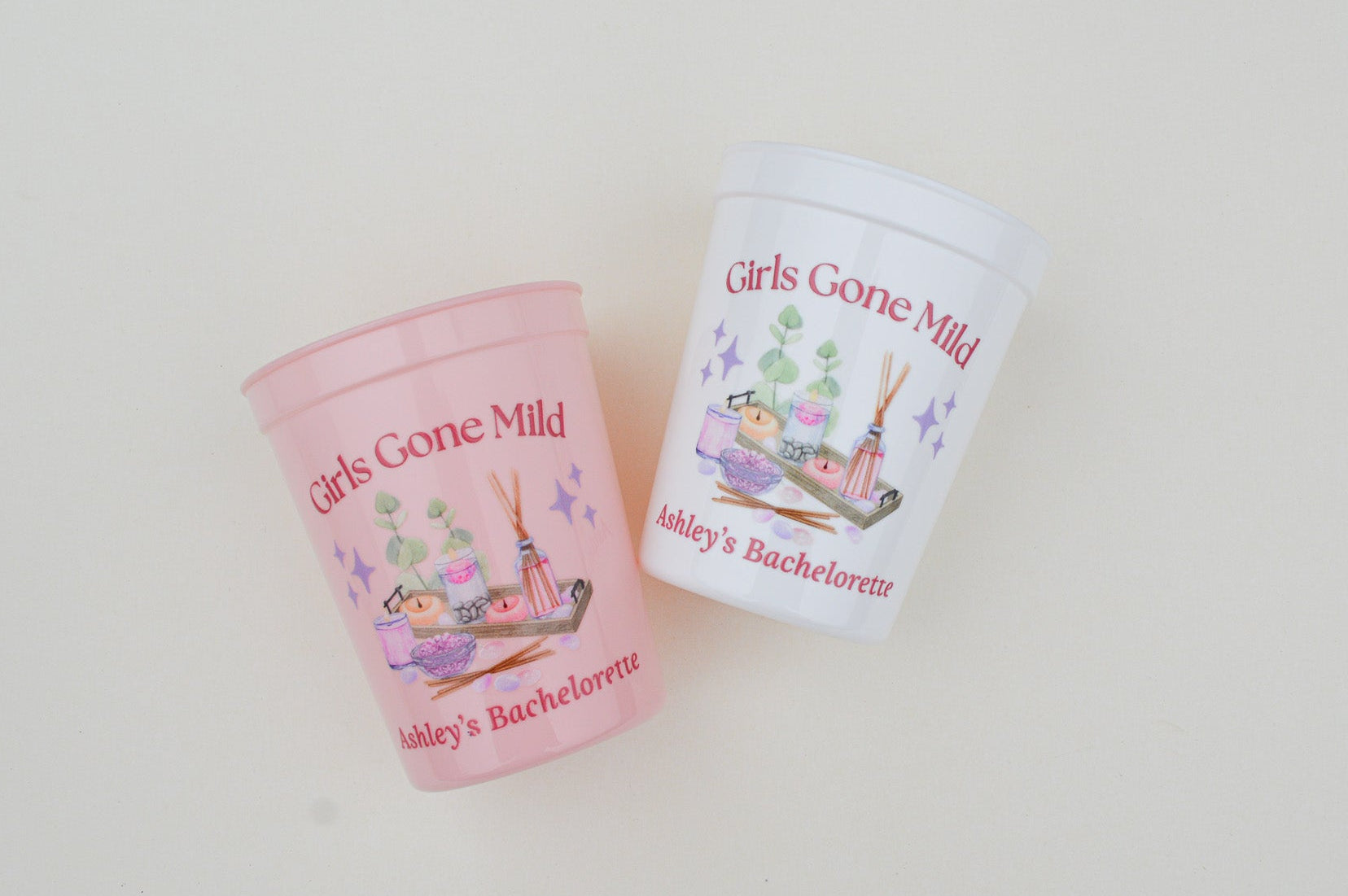 Two 'Girls Gone Mild' themed cups on a white background