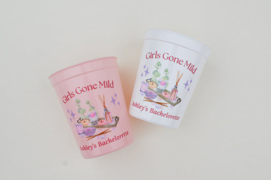Two 'Girls Gone Mild' themed cups on a white background