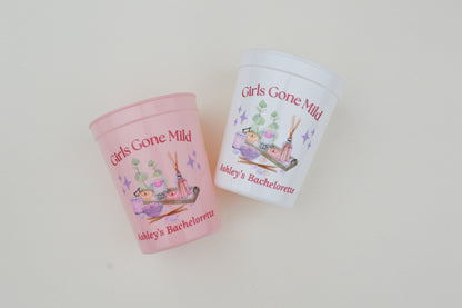Two personalized cups with illustrations and text on a white background