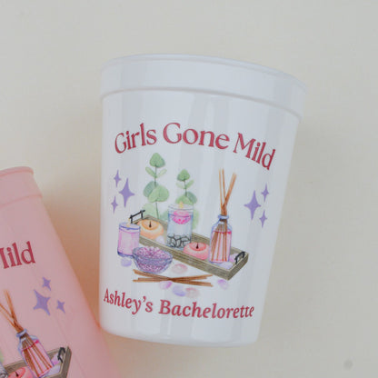 Personalized 'Girls Gone Mild' bachelorette party cup with pink card in the background.