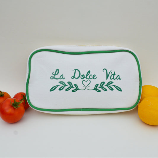 White bag with green trim and green lettering that says 'La Dolce Vita' on a white background