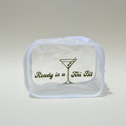 Clear pouch with text and a martini glass design on a light gray background