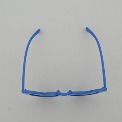 Blue eyeglass frame on a gray background
